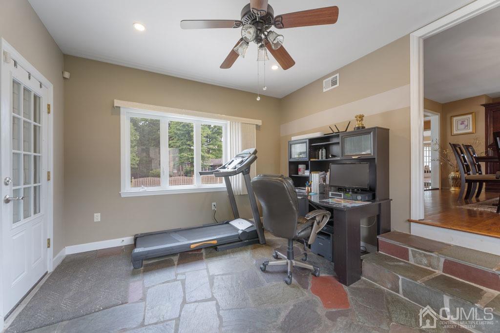 713 New Dover Road Edison, NJ 08820 - Photo 17 of 46 a view of a workspace with furniture and a window