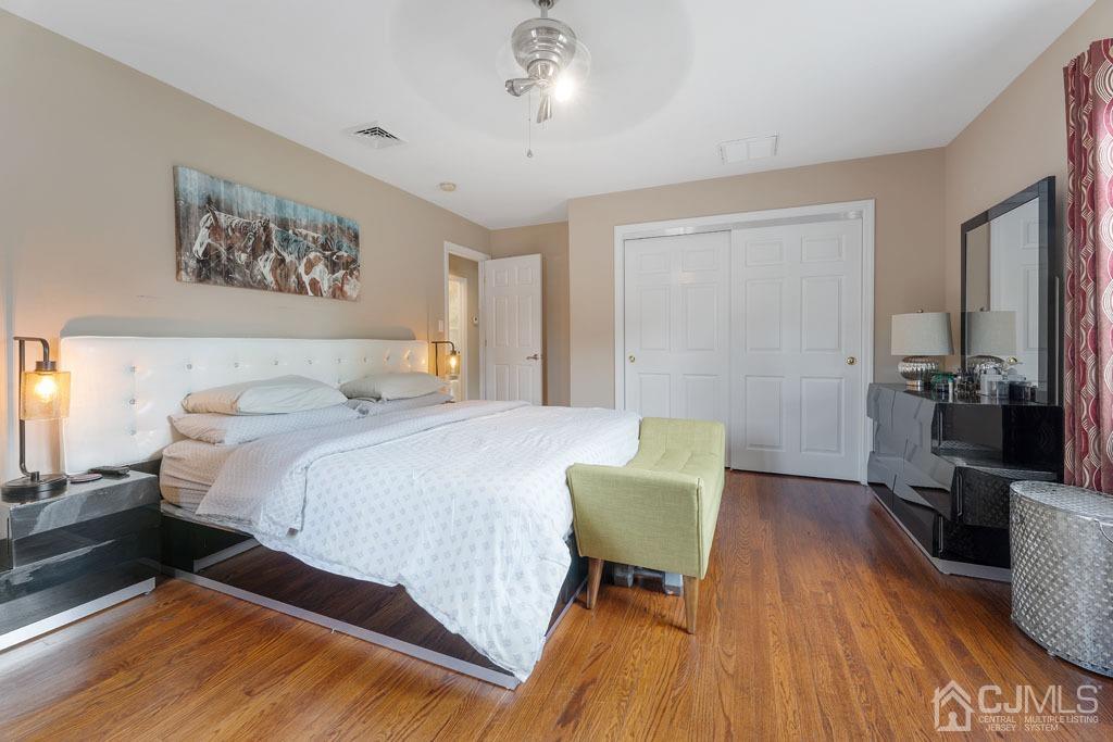 713 New Dover Road Edison, NJ 08820 - Photo 21 of 46 a bedroom with a bed and a table in it