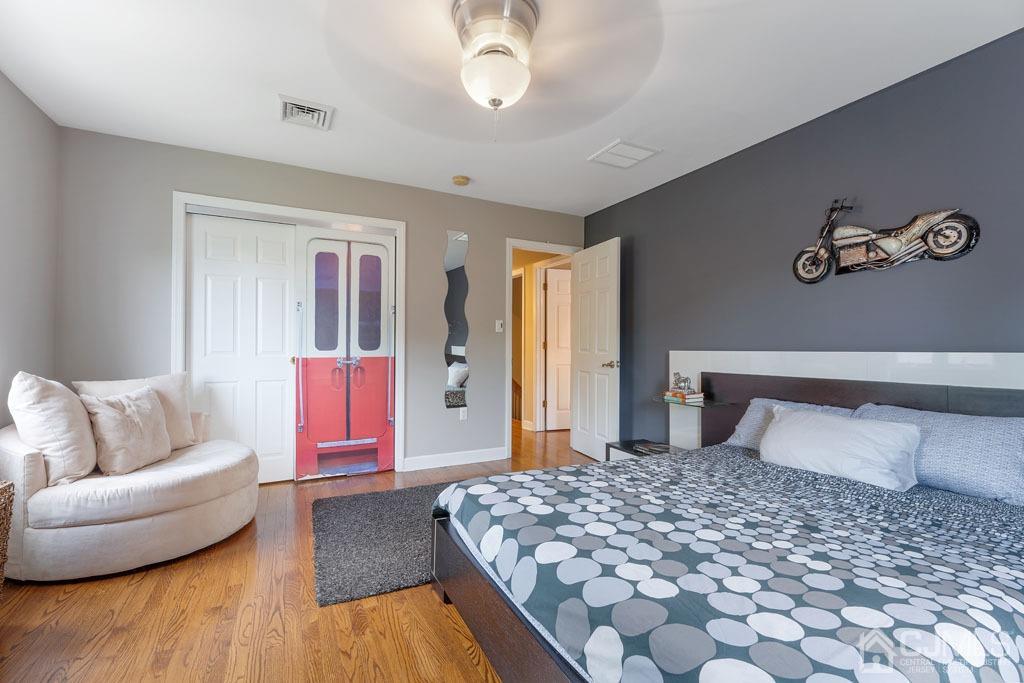 713 New Dover Road Edison, NJ 08820 - Photo 23 of 46 a bedroom with a large bed and a couch