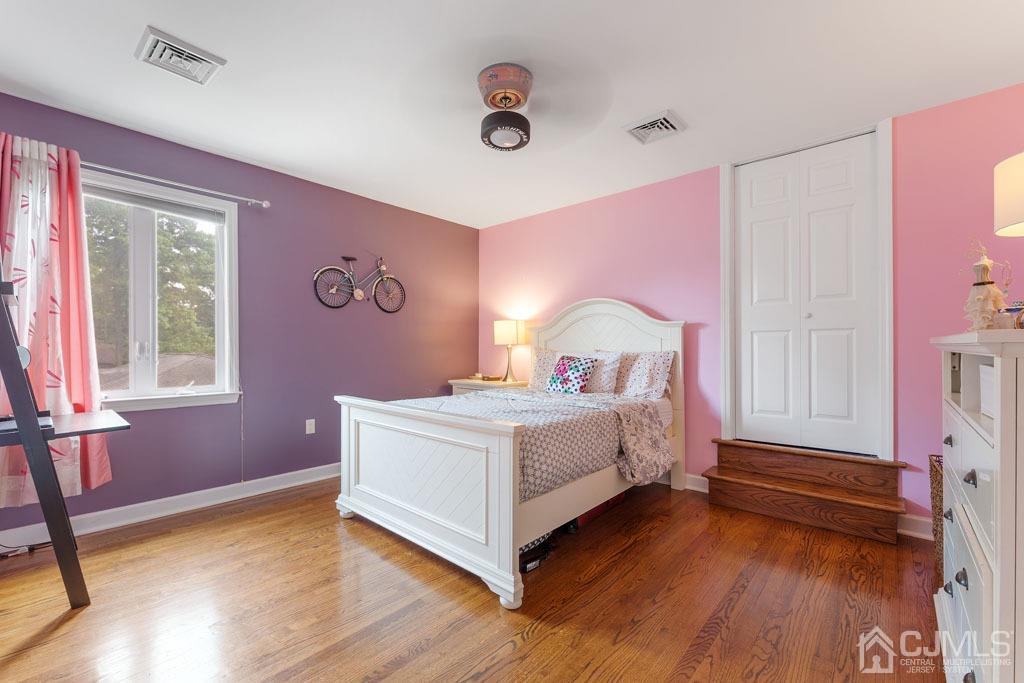 713 New Dover Road Edison, NJ 08820 - Photo 26 of 46 a bedroom with a bed and a window