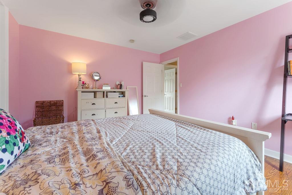 713 New Dover Road Edison, NJ 08820 - Photo 27 of 46 a bedroom with a bed and a dresser