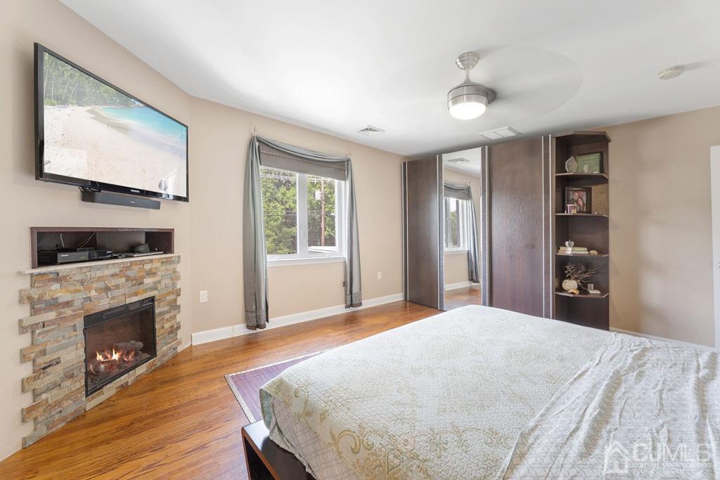 713 New Dover Road Edison, NJ 08820 - Photo 30 of 46 a bedroom with a bed and a flat screen tv