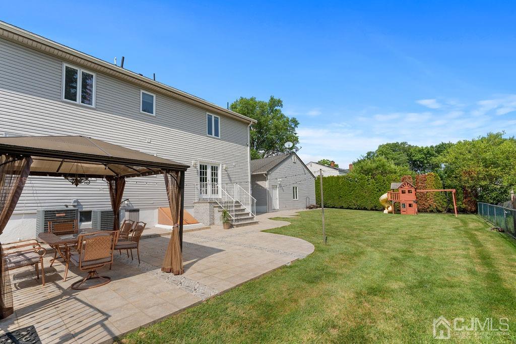 713 New Dover Road Edison, NJ 08820 - Photo 33 of 46 a view of a house with backyard porch and sitting area