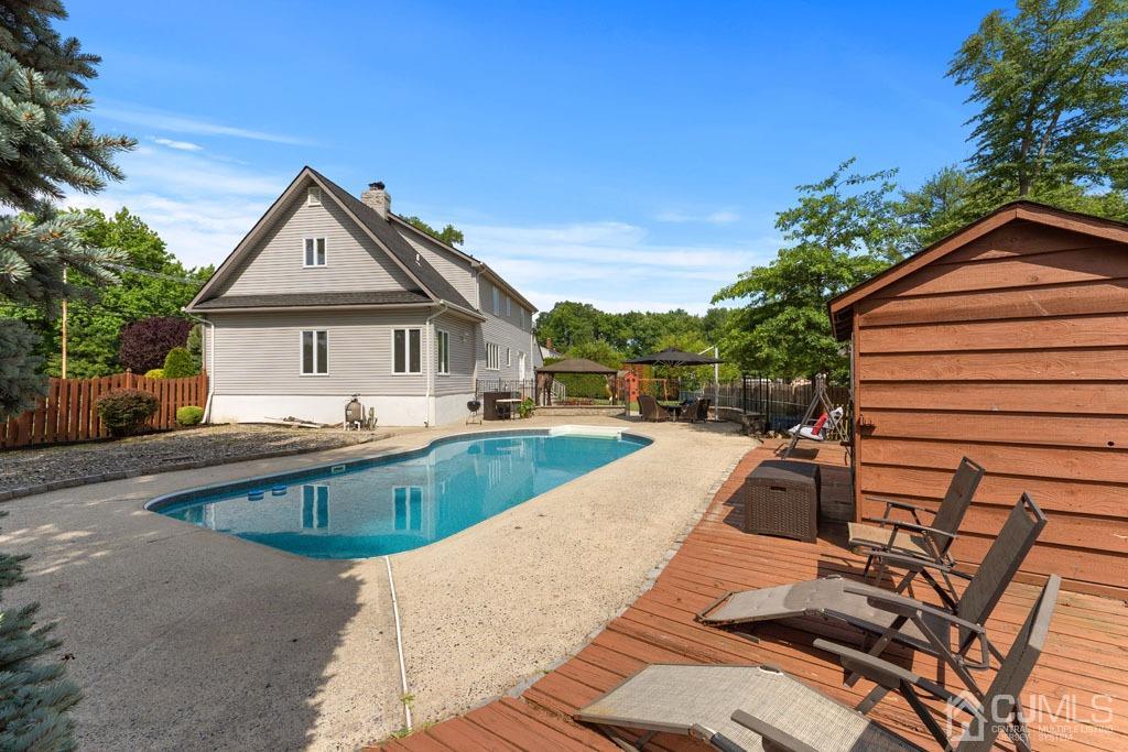 713 New Dover Road Edison, NJ 08820 - Photo 35 of 46 a view of house with swimming pool outdoor seating
