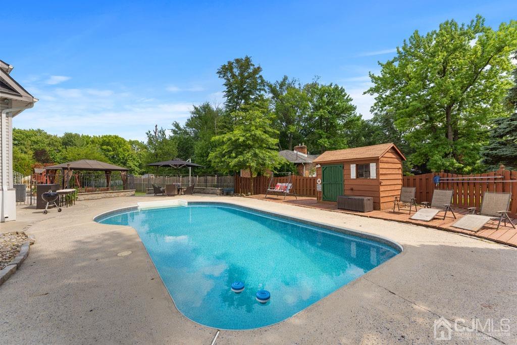 713 New Dover Road Edison, NJ 08820 - Photo 36 of 46 a view of a swimming pool with lounge chair
