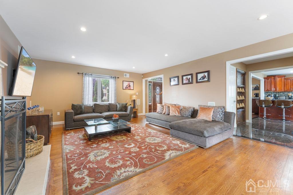 713 New Dover Road Edison, NJ 08820 - Photo 7 of 46 a living room with furniture and a flat screen tv