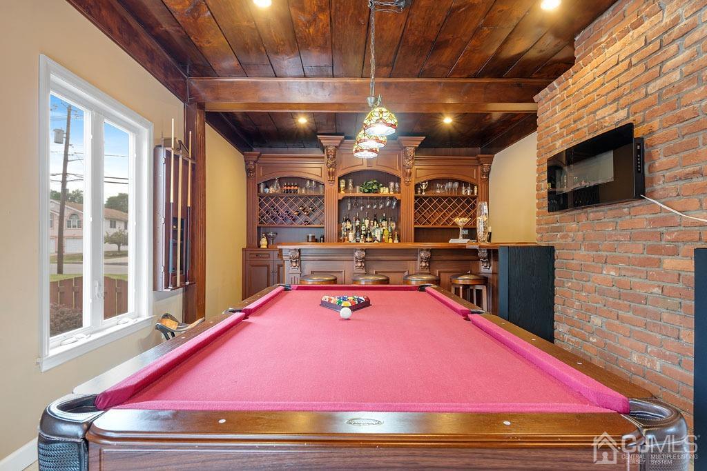 713 New Dover Road Edison, NJ 08820 - Photo 8 of 46 a room with pool table flat screen tv and windows