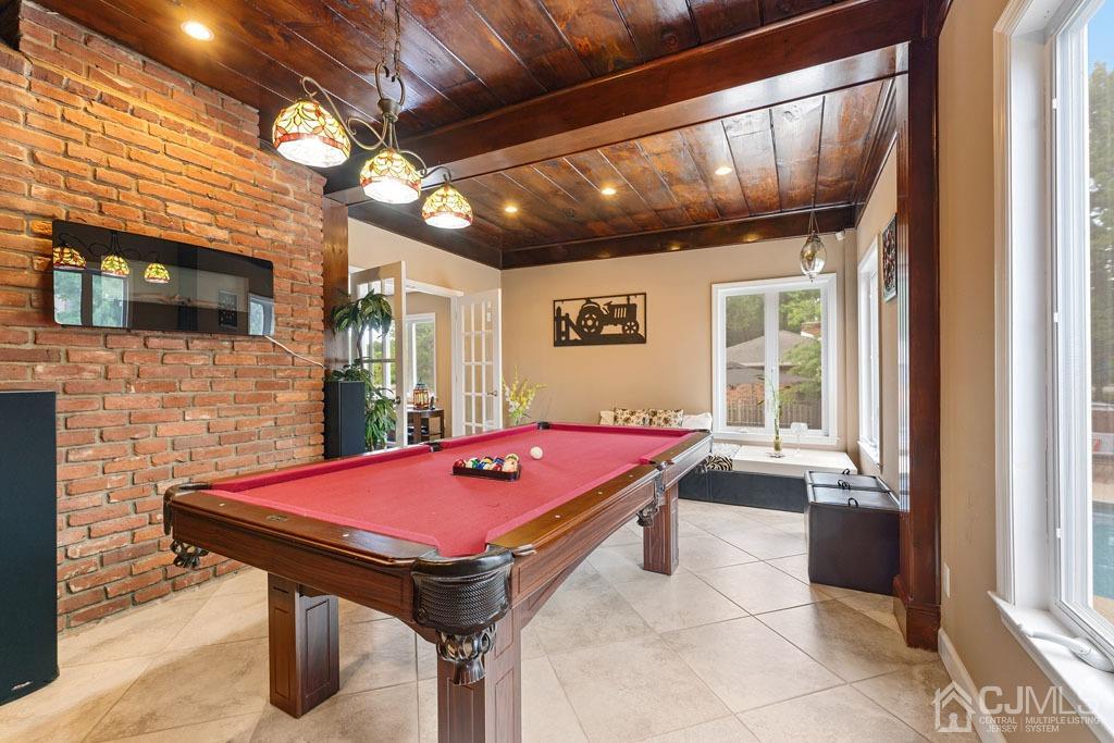 713 New Dover Road Edison, NJ 08820 - Photo 10 of 46 a room with pool table and flat screen tv