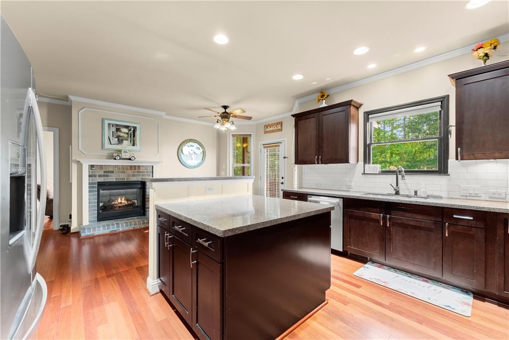 799 Traditions Way Jefferson, GA 30549 - Photo 12 of 53 a kitchen with stainless steel appliances granite countertop a sink stove and refrigerator