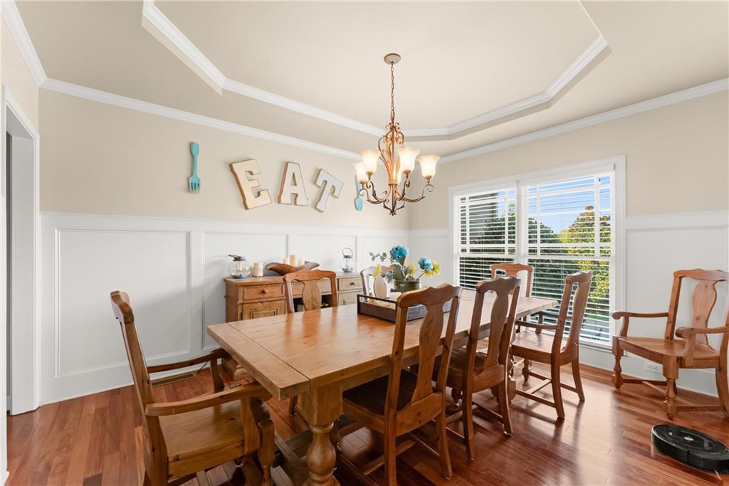 799 Traditions Way Jefferson, GA 30549 - Photo 16 of 53 a view of a dining room with furniture window and wooden floor