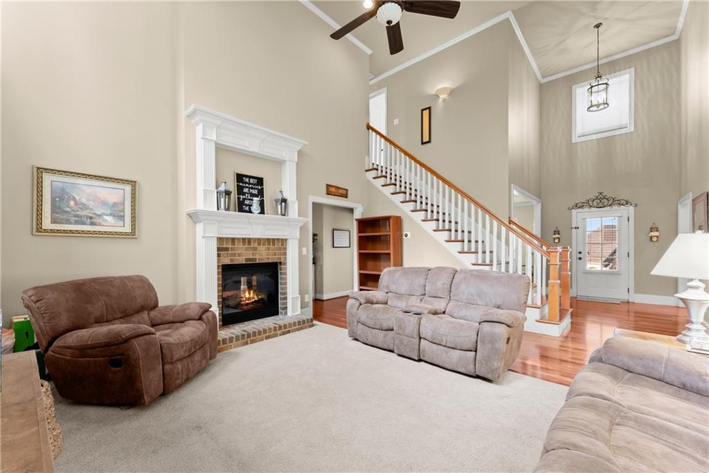 799 Traditions Way Jefferson, GA 30549 - Photo 19 of 53 a living room with furniture and a fireplace