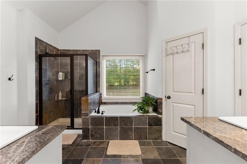 799 Traditions Way Jefferson, GA 30549 - Photo 23 of 53 a bathroom with a granite countertop sink and a mirror