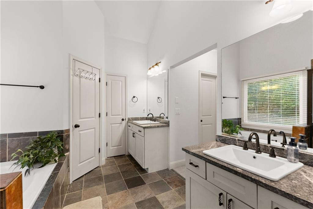 799 Traditions Way Jefferson, GA 30549 - Photo 24 of 53 a spacious bathroom with a double vanity sink a mirror and a shower