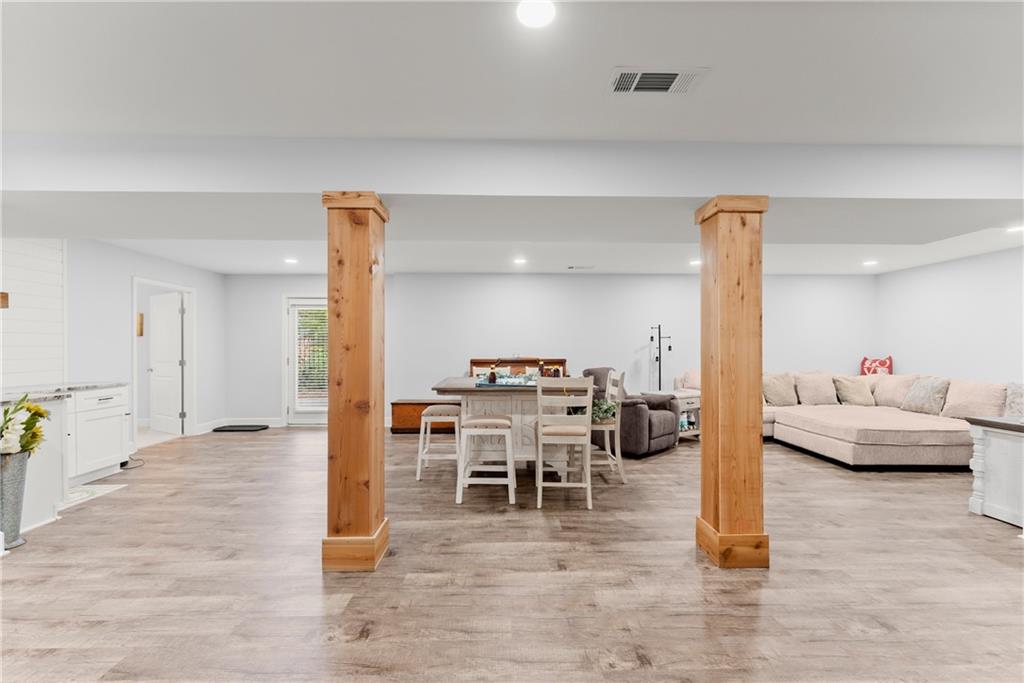 799 Traditions Way Jefferson, GA 30549 - Photo 32 of 53 a living room with furniture and wooden floor