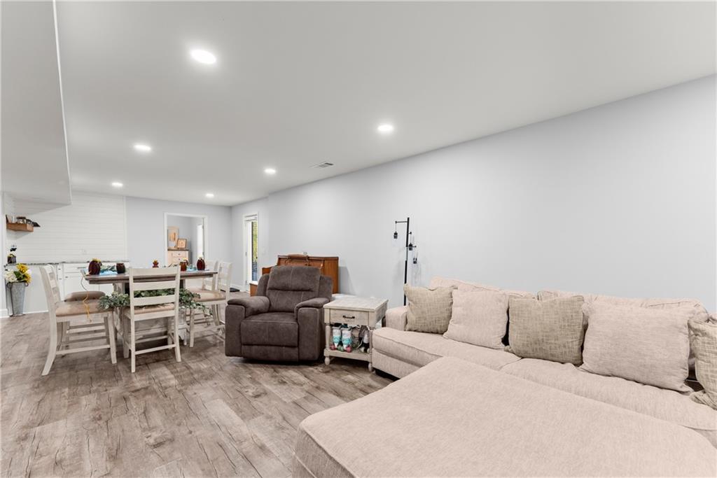 799 Traditions Way Jefferson, GA 30549 - Photo 33 of 53 a living room with furniture and a flat screen tv