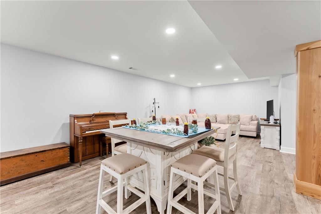 799 Traditions Way Jefferson, GA 30549 - Photo 34 of 53 a view of a dining room with furniture and wooden floor