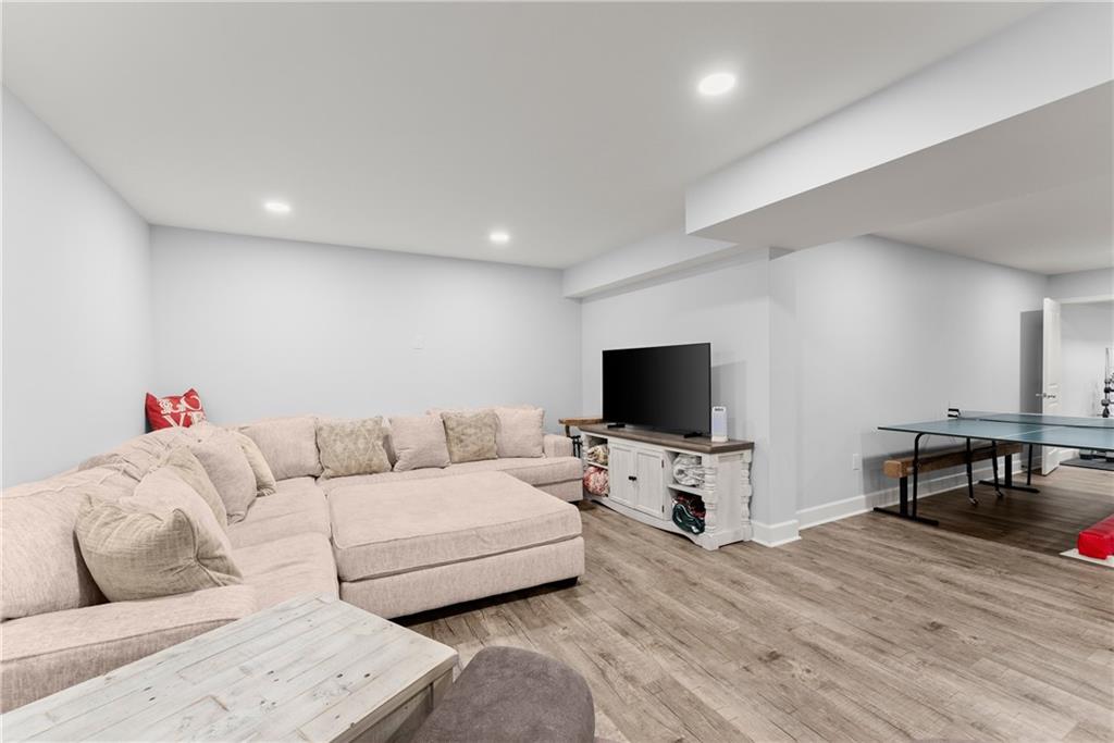 799 Traditions Way Jefferson, GA 30549 - Photo 36 of 53 a living room with furniture and a flat screen tv
