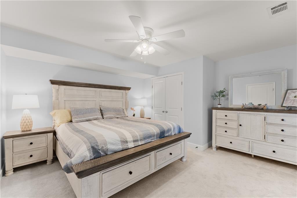 799 Traditions Way Jefferson, GA 30549 - Photo 40 of 53 a bedroom with a bed and a dresser