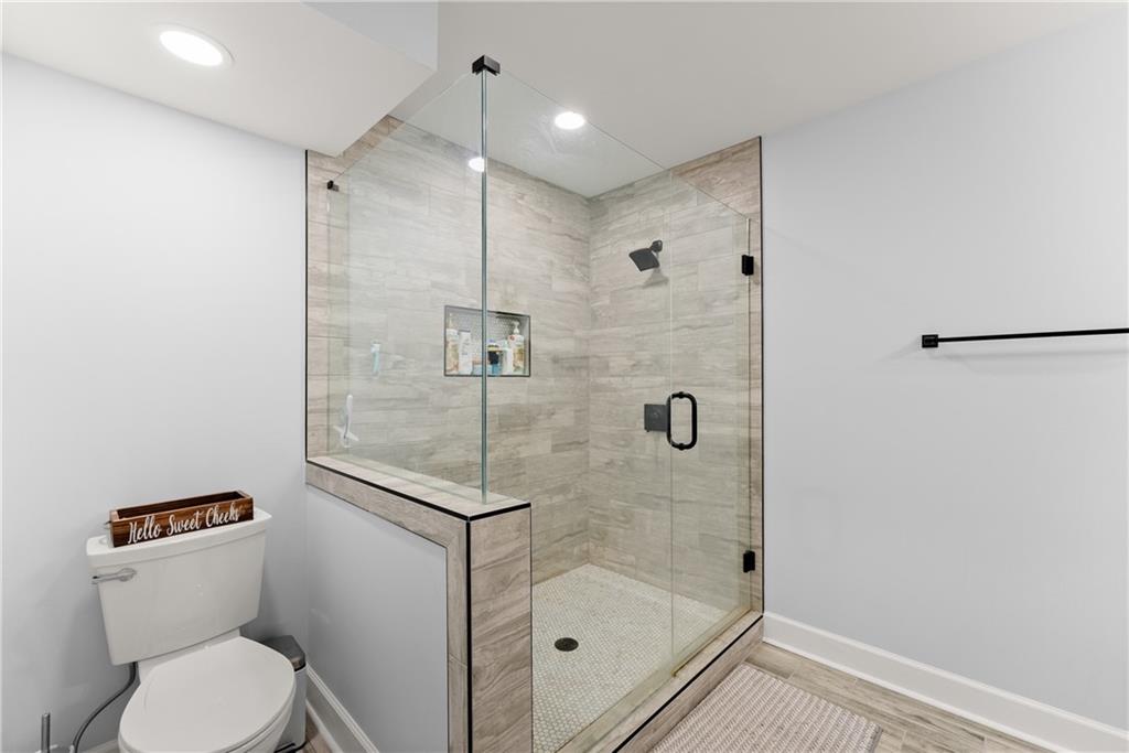 799 Traditions Way Jefferson, GA 30549 - Photo 43 of 53 a bathroom with a shower a toilet and a shower