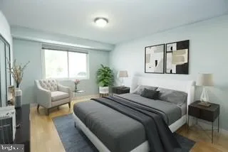 a bedroom with a bed and a couch