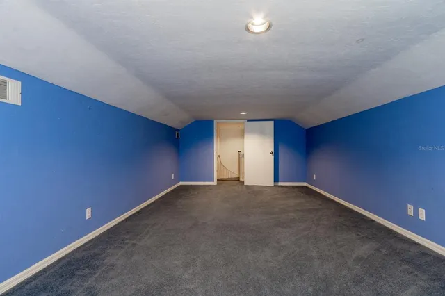 a utility room with cabinets and washer