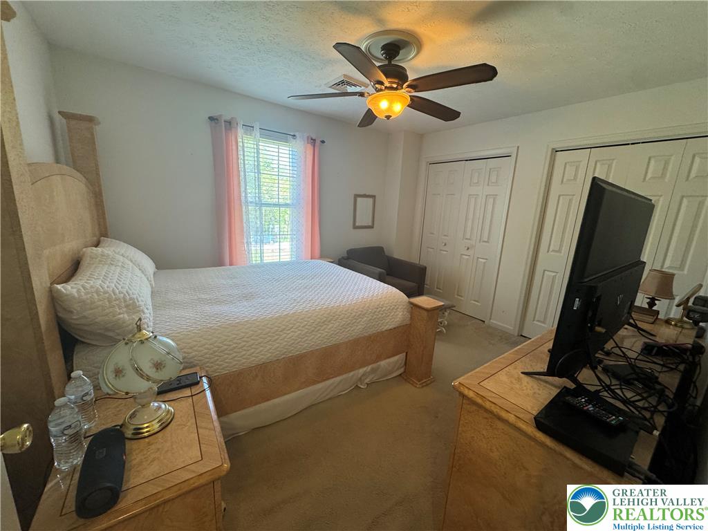 2742 Long Pond Road Long Pond, PA 18334 - Photo 36 of 57 Relax in this tranquil bedroom, featuring soft carpet flooring and ample closet space.