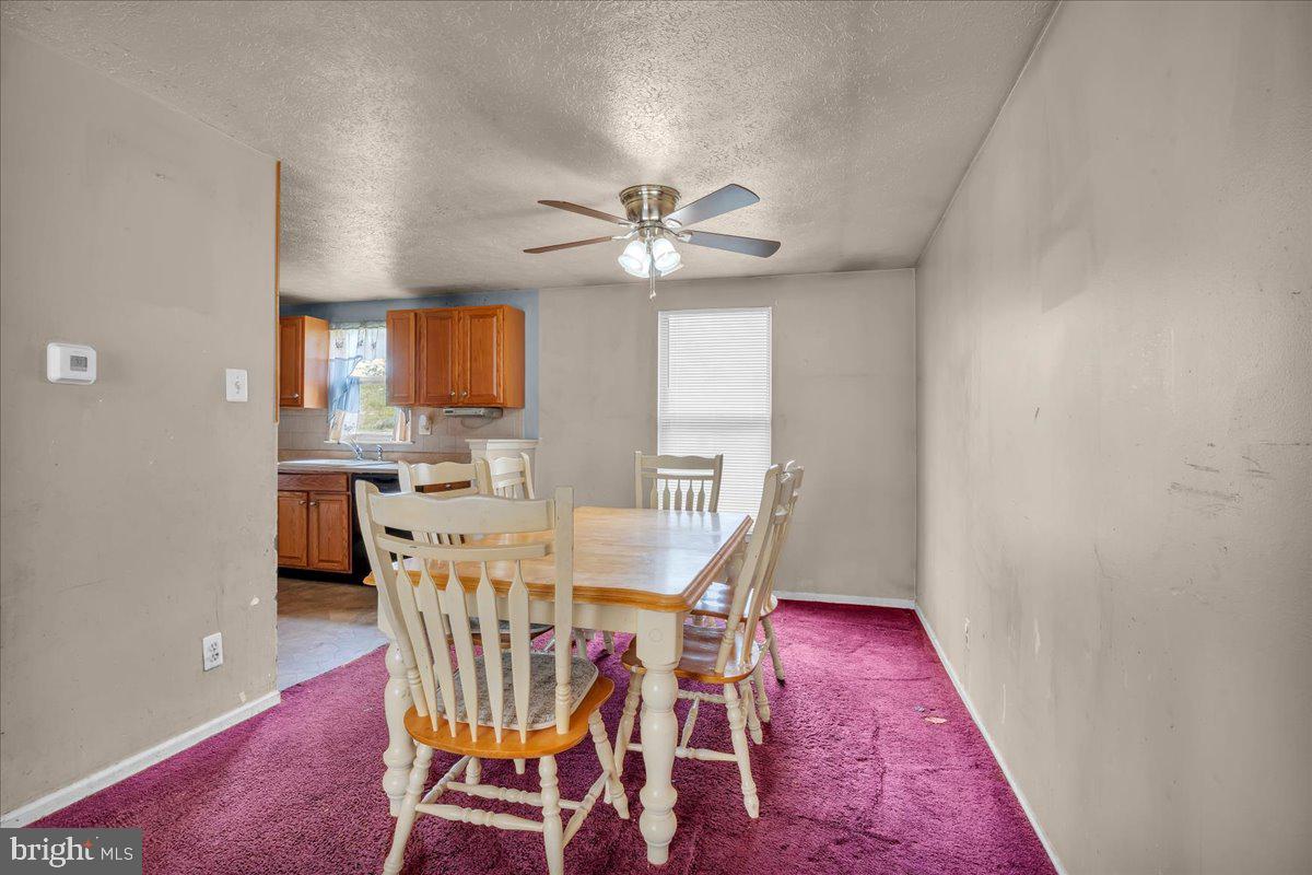11 Decatur Lane Sicklerville, NJ 08081 - Photo 7 of 24 a view of a dining room with furniture and a chandelier fan