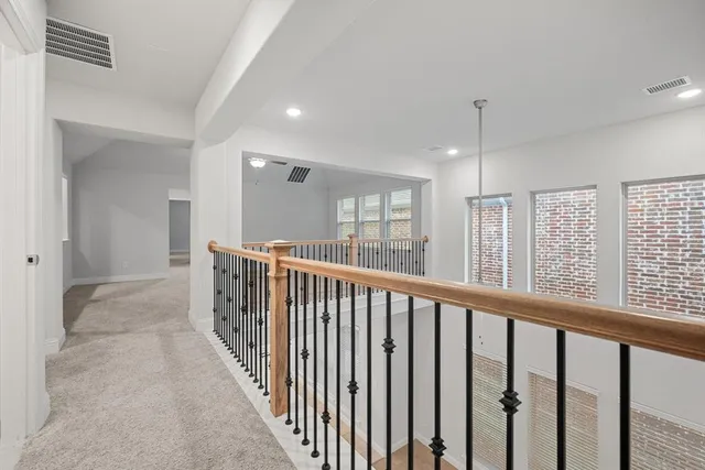 a view of a livingroom with a ceiling fan and window