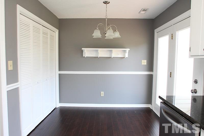 1464 Langdon Road Angier, NC 27501 - Photo 5 of 12 a view of an empty room with wooden floor and a window