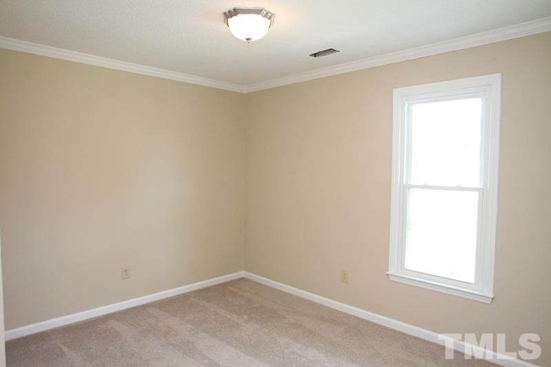 1464 Langdon Road Angier, NC 27501 - Photo 6 of 12 an empty room with a window