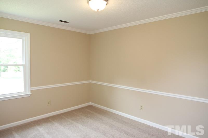 1464 Langdon Road Angier, NC 27501 - Photo 7 of 12 a view of an empty room with a window