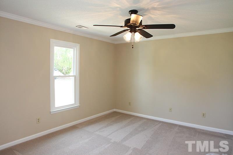 1464 Langdon Road Angier, NC 27501 - Photo 9 of 12 a view of empty room with ceiling fan