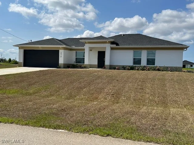 front view of a house with a yard