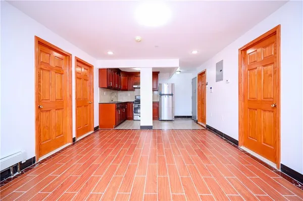 a view of kitchen and wooden floor