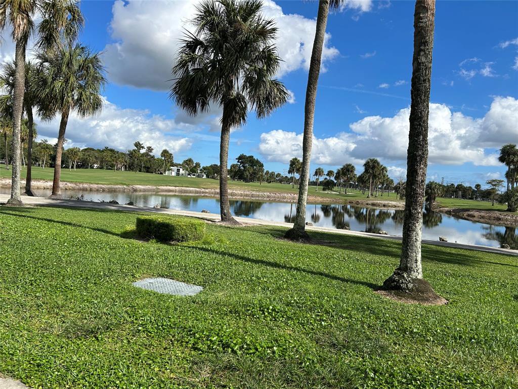 7807 Golf Cir Drive, Unit 205 Margate, FL 33063 - Photo 2 of 5 a view of a park with palm trees