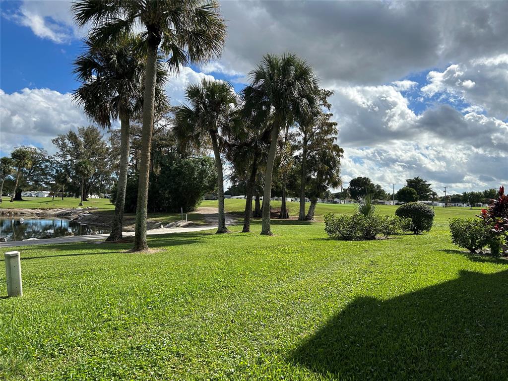 7807 Golf Cir Drive, Unit 205 Margate, FL 33063 - Photo 3 of 5 a view of a park with a tree