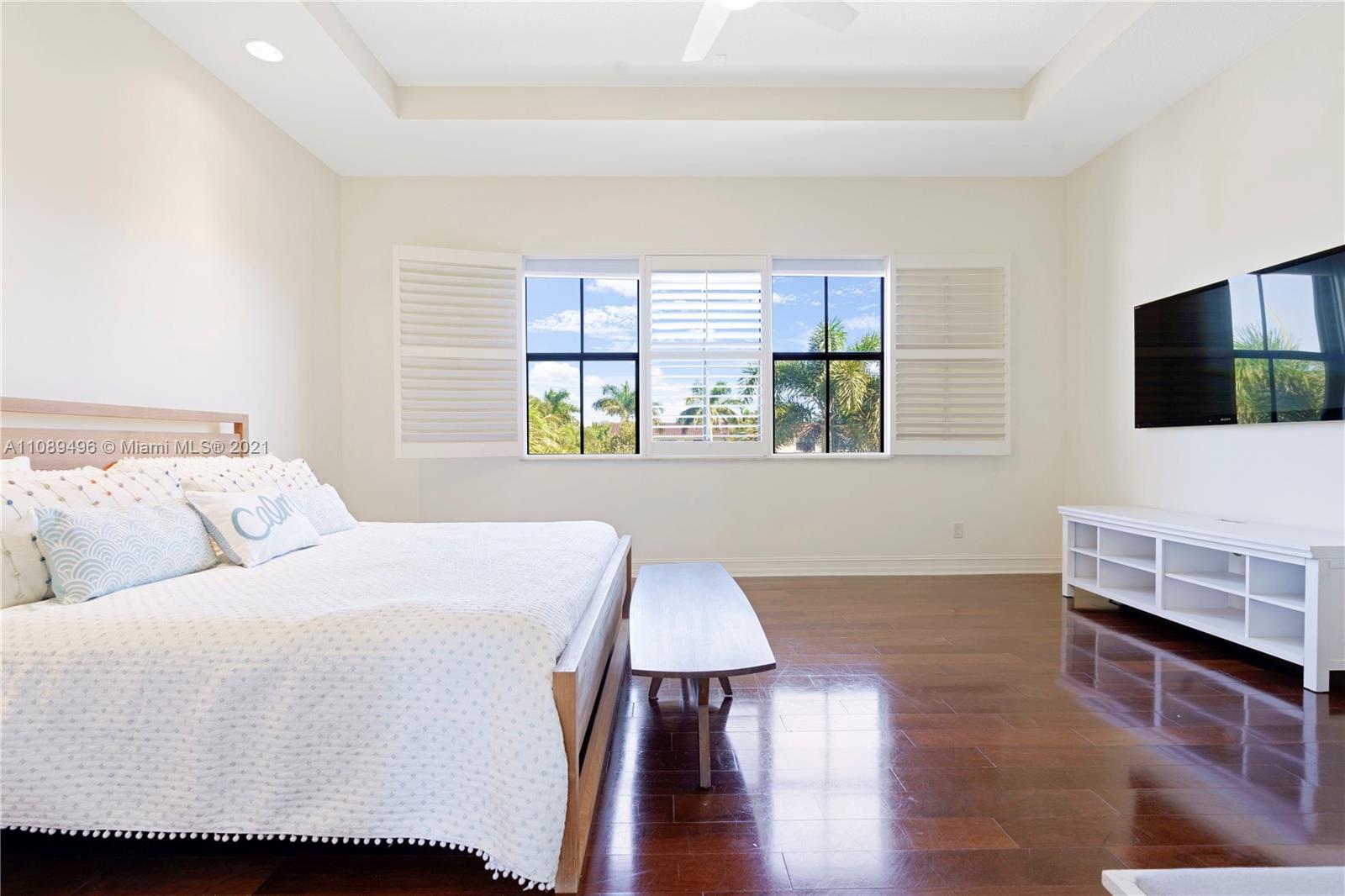 17752 Vecino Way Boca Raton, FL 33496 - Photo 12 of 30 a living room with furniture and a flat screen tv