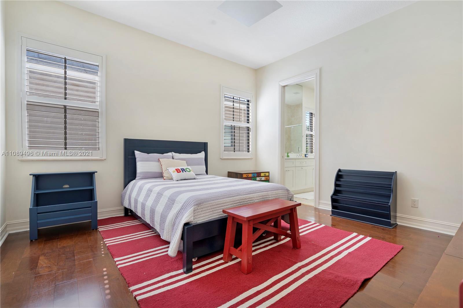 17752 Vecino Way Boca Raton, FL 33496 - Photo 16 of 30 a bedroom with a bed and a dresser