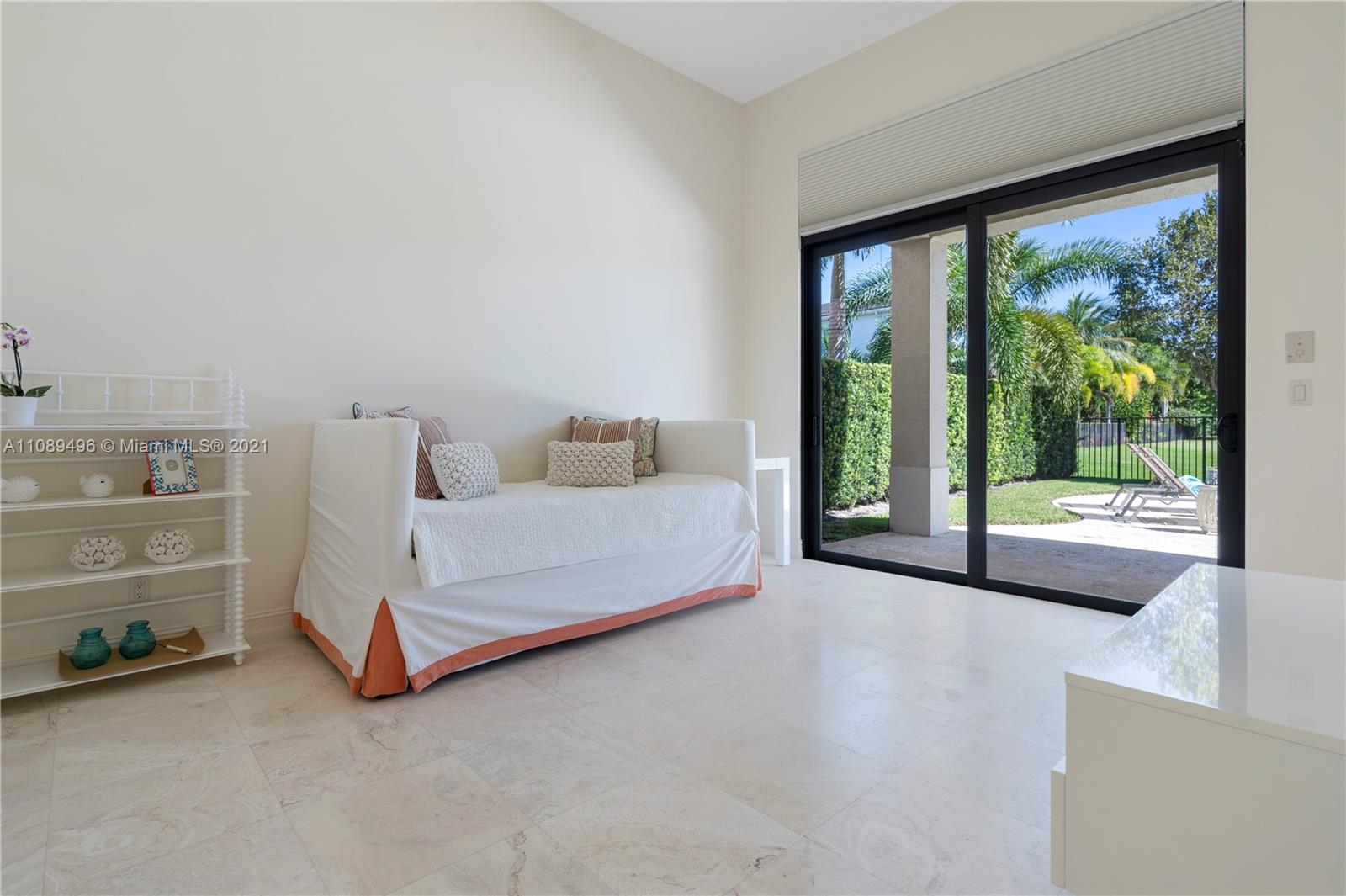 17752 Vecino Way Boca Raton, FL 33496 - Photo 18 of 30 a spacious bedroom with a bed and large window