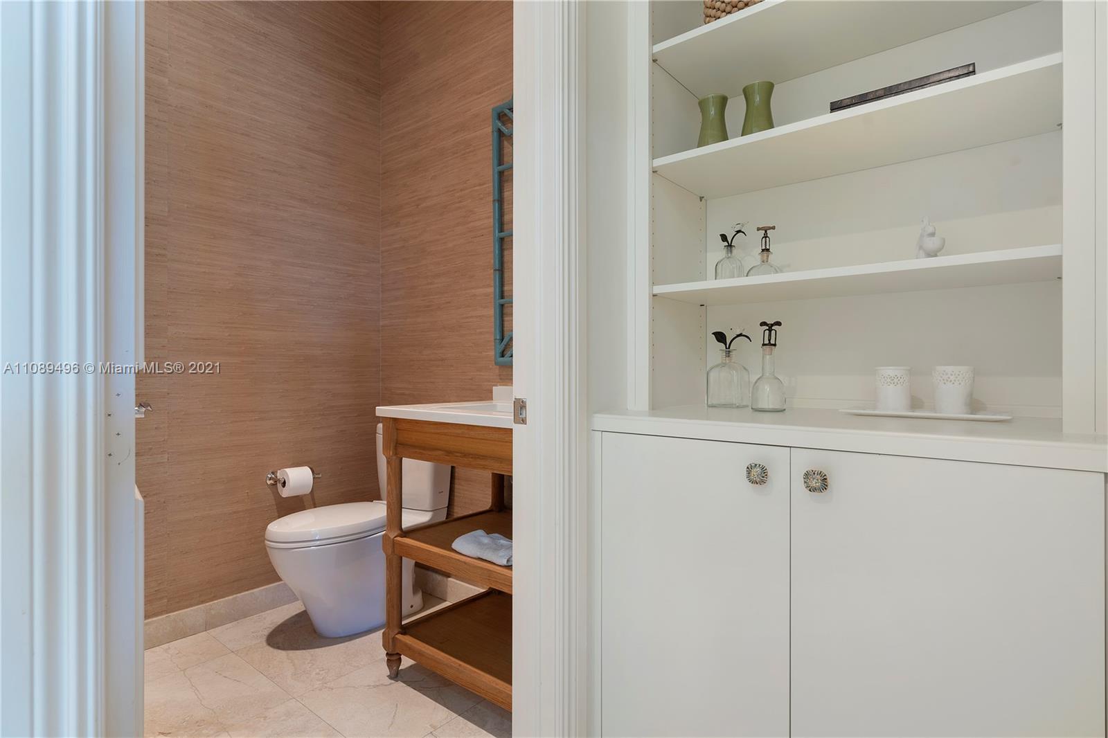 17752 Vecino Way Boca Raton, FL 33496 - Photo 20 of 30 a bathroom with a toilet and a sink