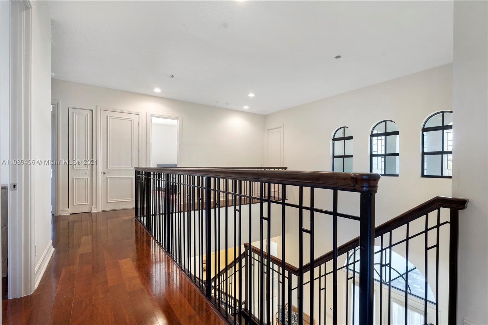 17752 Vecino Way Boca Raton, FL 33496 - Photo 25 of 30 a view of staircase with wooden floor
