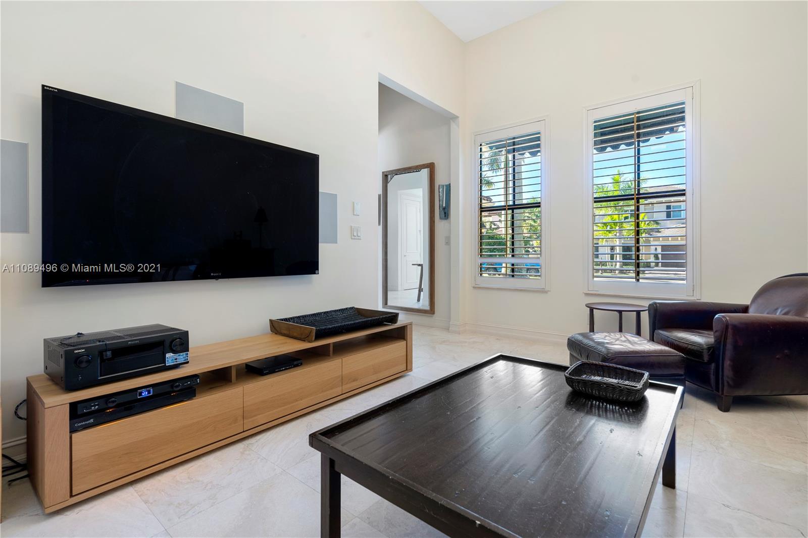 17752 Vecino Way Boca Raton, FL 33496 - Photo 6 of 30 a living room with furniture and a flat screen tv