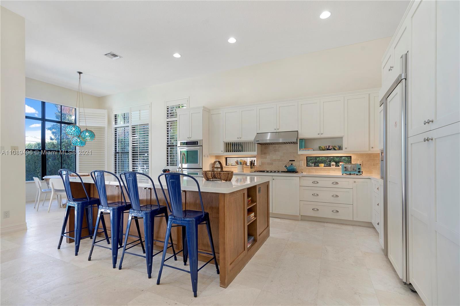 17752 Vecino Way Boca Raton, FL 33496 - Photo 10 of 30 a kitchen that has a lot of cabinets in it and appliances