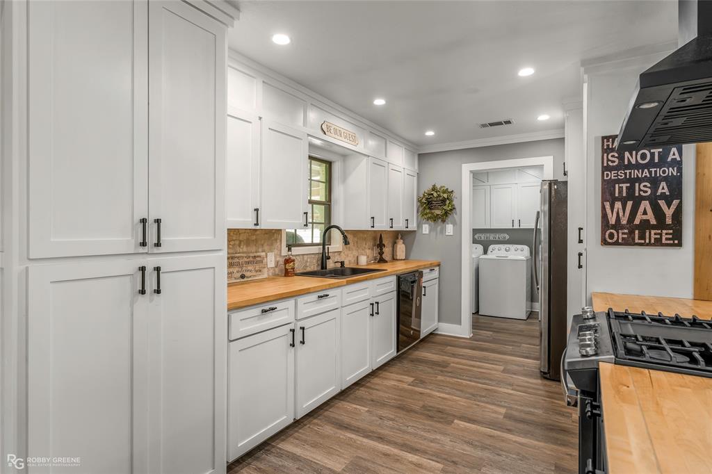 1426 Caney Lake Road Minden, LA 71055 - Photo 9 of 36 Kitchen featuring white shaker-style cabinetry, wood-finish countertops, black appliances, a tile backsplash, and recessed lighting