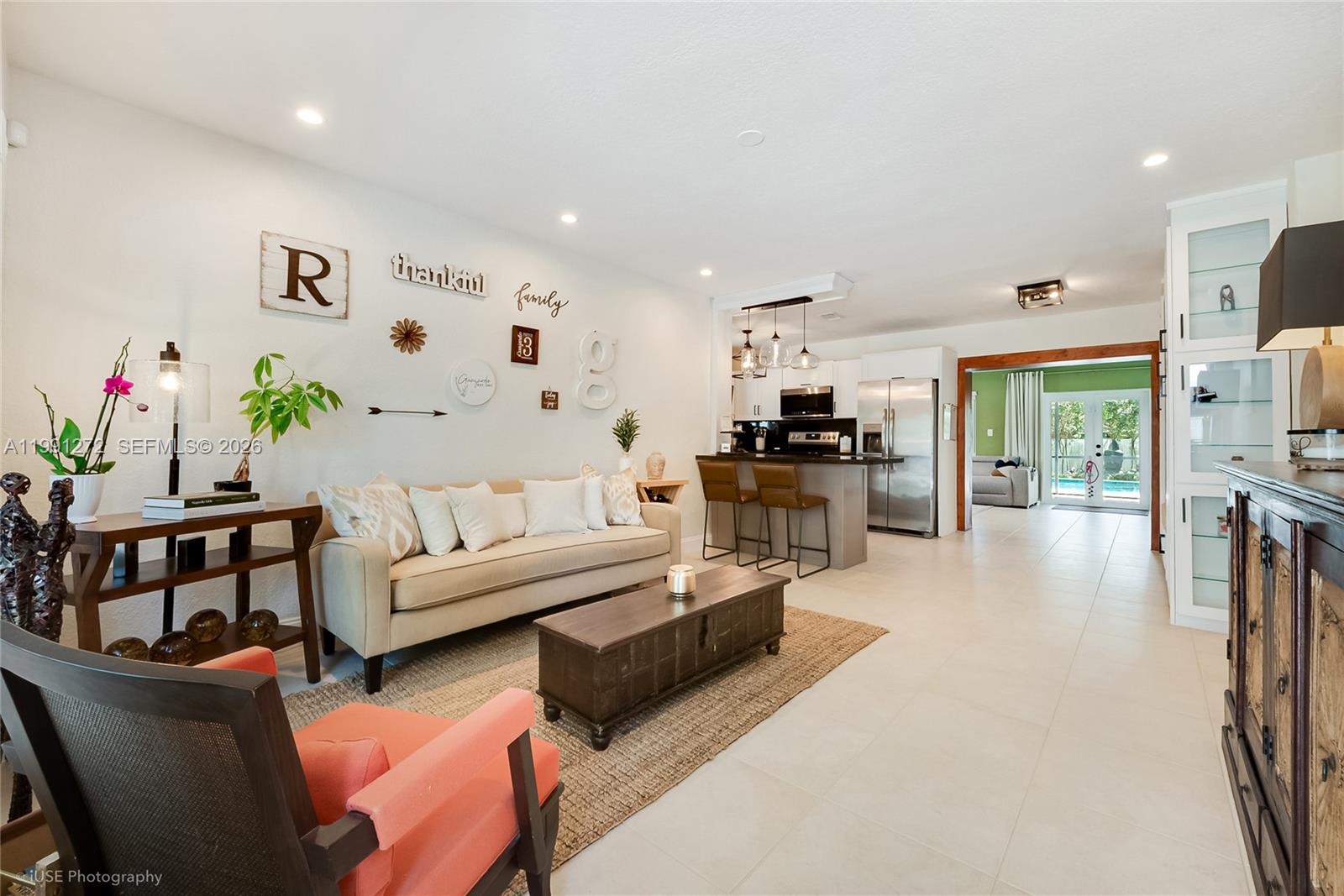 8535 Southwest 97th Road Miami, FL 33173 - Photo 6 of 28 a living room with furniture and kitchen view