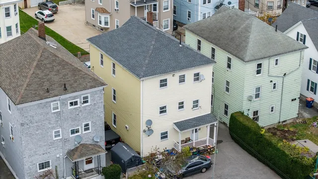 a aerial view of a house with a yard