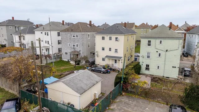 a view of multiple houses with a yard
