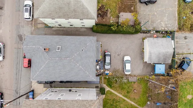 an aerial view of residential houses with outdoor space