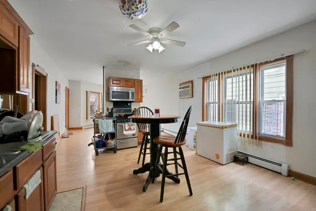 a view of a livingroom with furniture and a window