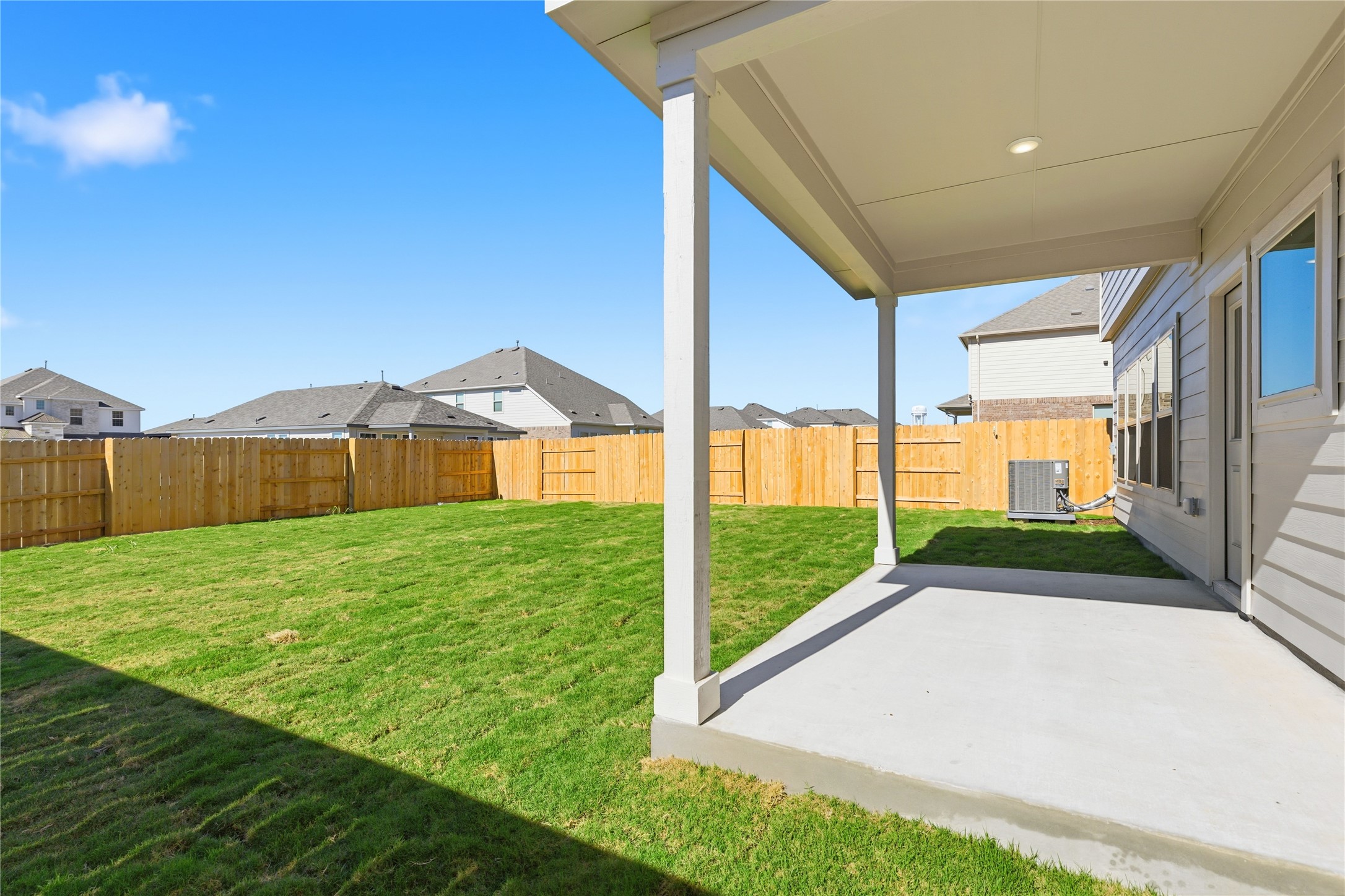 13700 Tucker Hedge Pass Elgin, TX 78621 - Photo 13 of 16 Fenced backyard featuring a patio and a residential view